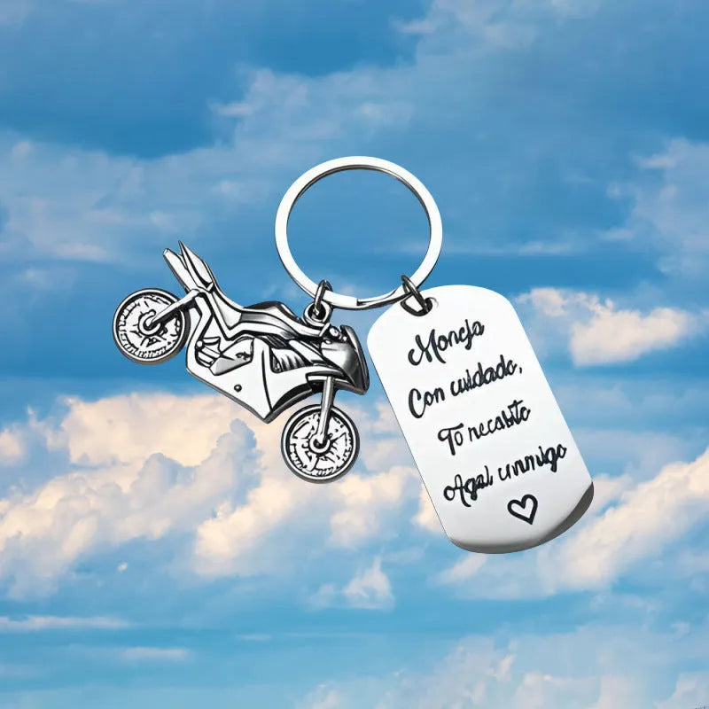 Stainless steel motorcycle keychain on a flannel bag.