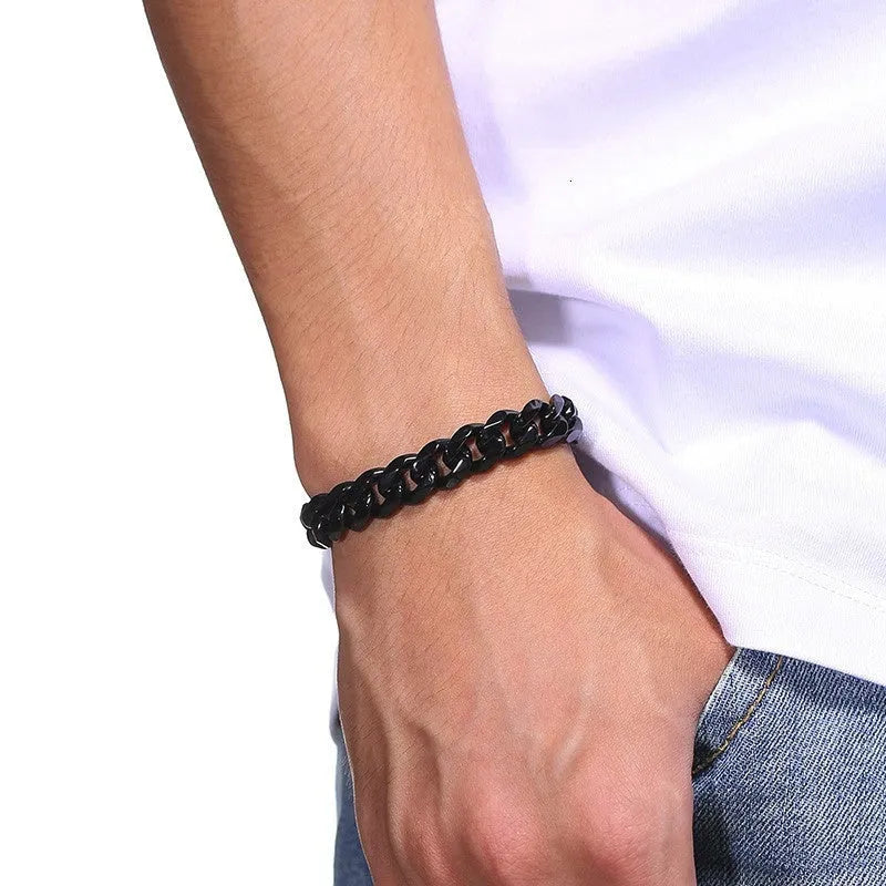 Six-sided geometric link metal bracelet in gold colour on a wrist.