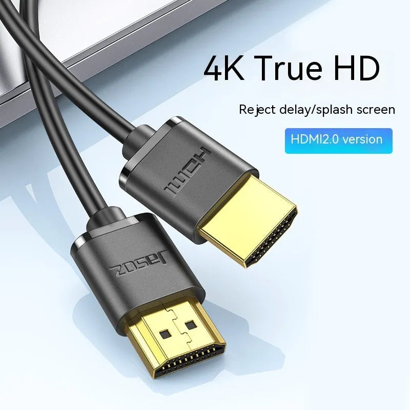 Gold-plated HDMI cable with thin black wire, shown with connector close-up highlighting contacts.