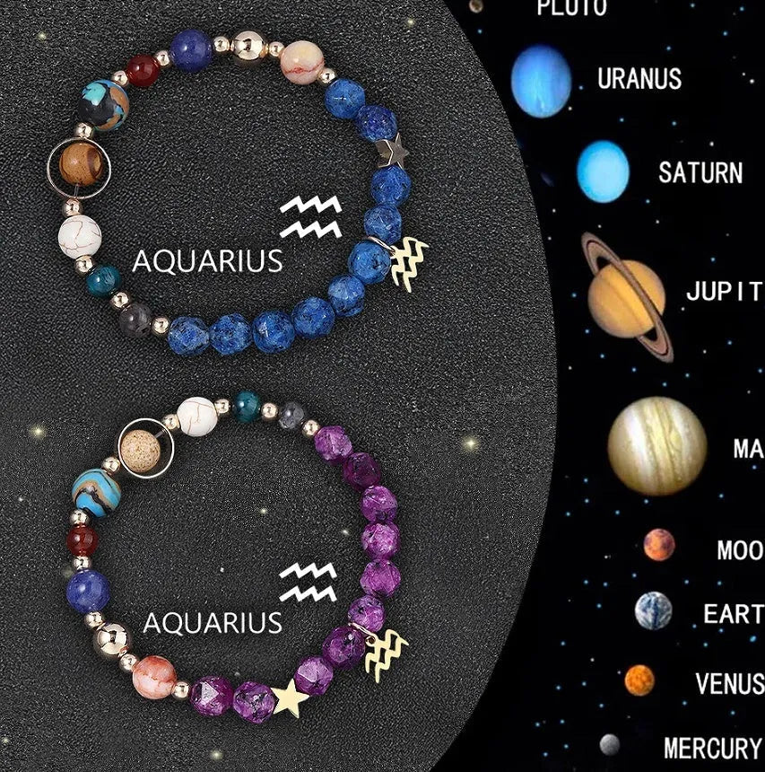 Set of two natural stone beaded bracelets with metal zodiac charms on a dark background.
