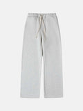 Men's black fleece-lined sweatpants with elastic drawstring waist shown in loose fit