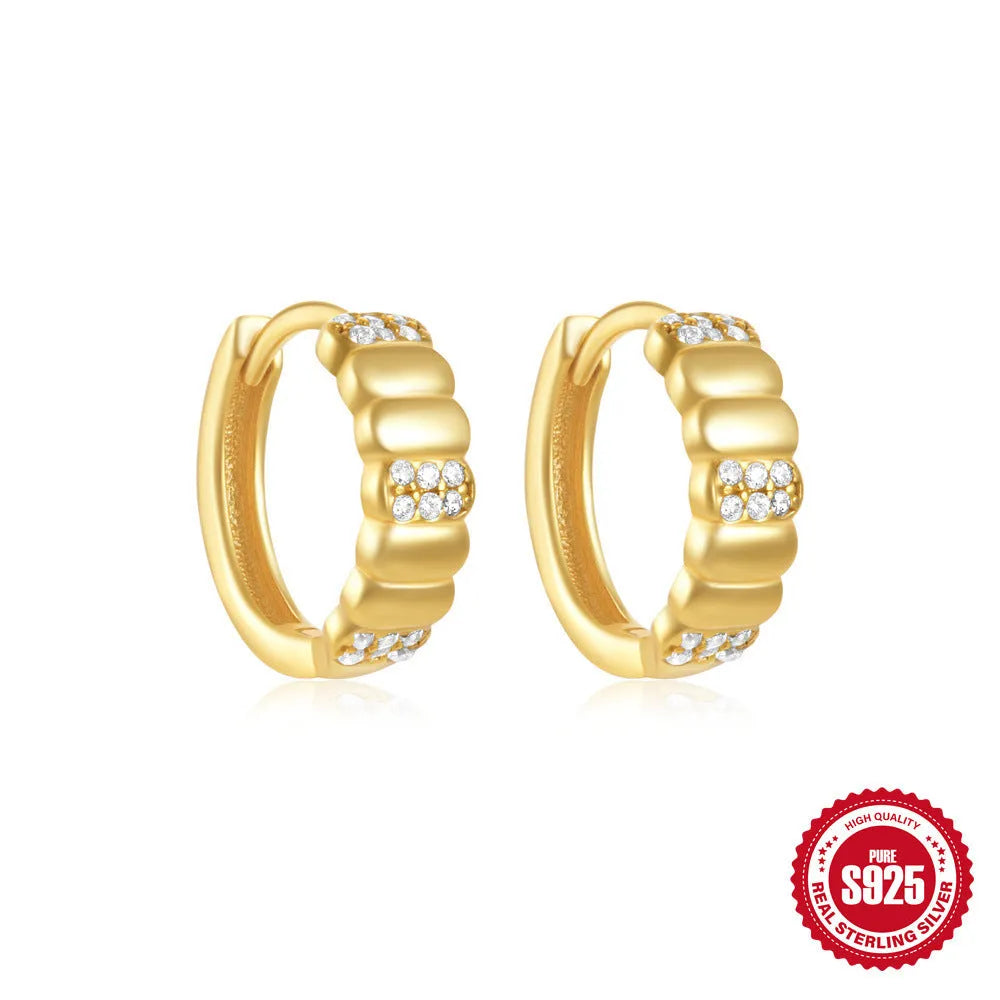 Sterling silver geometric stud earrings with small round diamond detailing in gold and silver electroplated finishes
