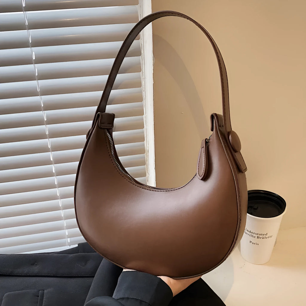 Retro dumpling-shaped women's shoulder bag in PU leather with sandwich pocket exterior
