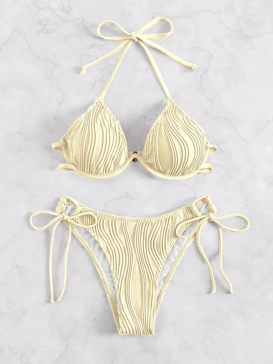 Women's apricot coloured underwire bikini swimsuit with adjustable side-tie bottoms on a mannequin.