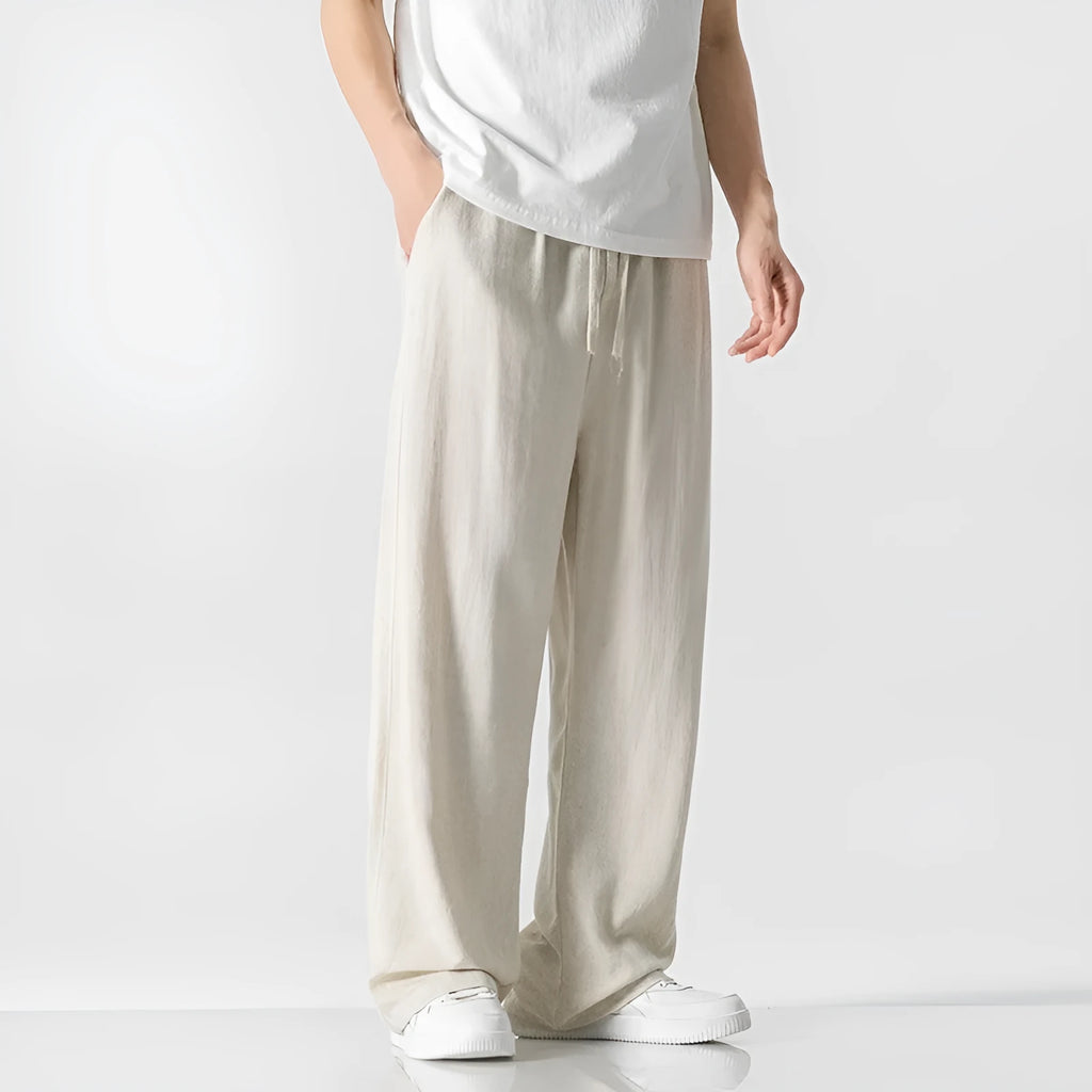 Men's beige linen casual trousers with a loose straight-leg fit and drawstring waist.