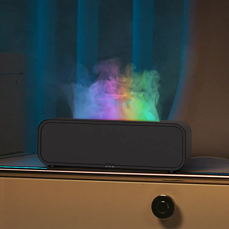 Black and white aroma diffuser with dynamic flame LED light effect on a table.
