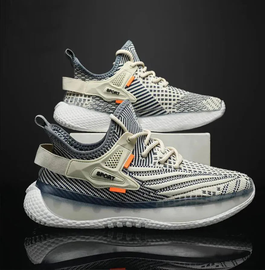 Men's low-top white mesh sneakers with a rubber sole and round toe on a plain background.