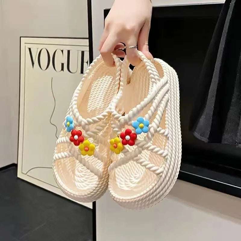 Women's floral decorated PVC sandals in beige or black with non-slip soles