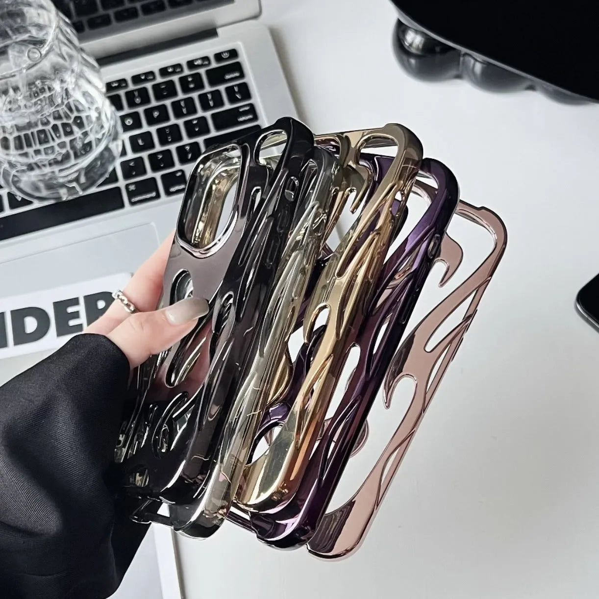 Electroplating hollow flame pattern iPhone case in silver finish on TPU soft shell