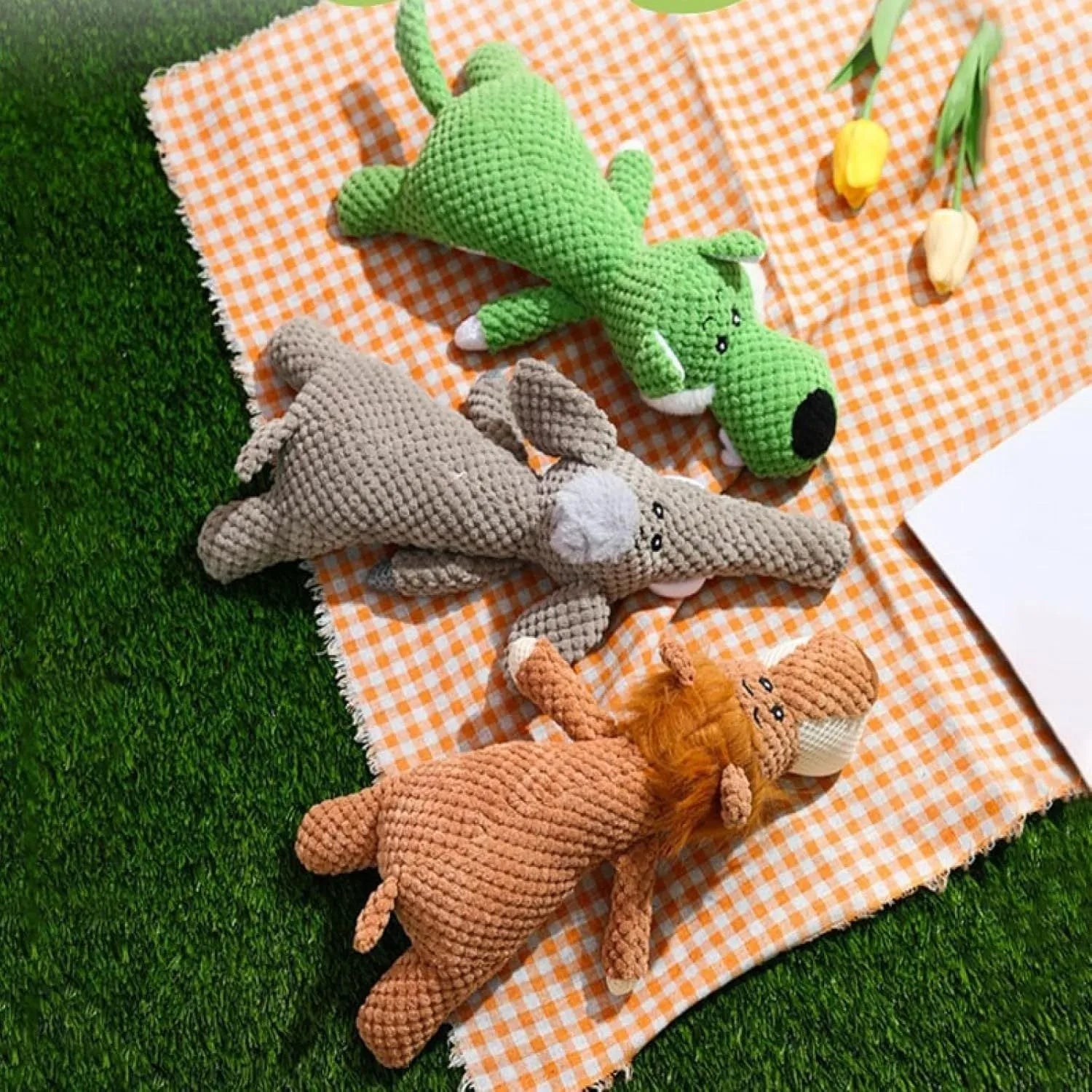Plush dog toy with corn kernel texture in green grey or yellow featuring a built-in sound device for teeth grinding
