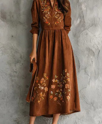 Brown polyester midi dress with floral embroidery detail and long sleeves on a hanger.