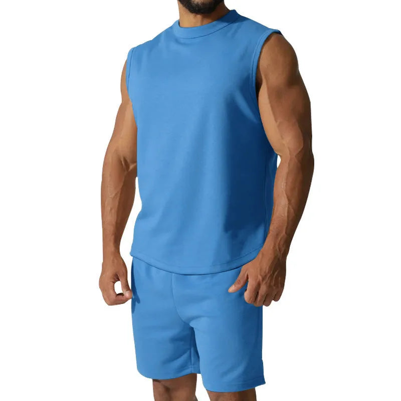 Men's sleeveless cotton blend sports top and shorts set in a solid colour.