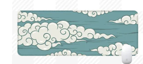 Large natural rubber desk mat with Japanese cloud pattern on a wooden desk, showing non-slip base.