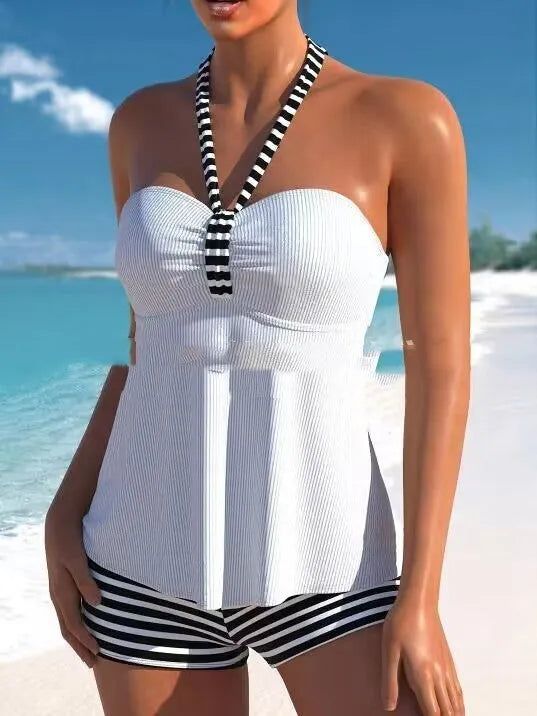 Women's black and white striped off-shoulder swimsuit with briefs cut on mannequin