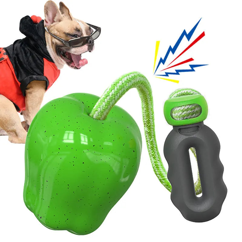 Plastic dog dental toy with dropping ball design for molar cleaning in green and red colours