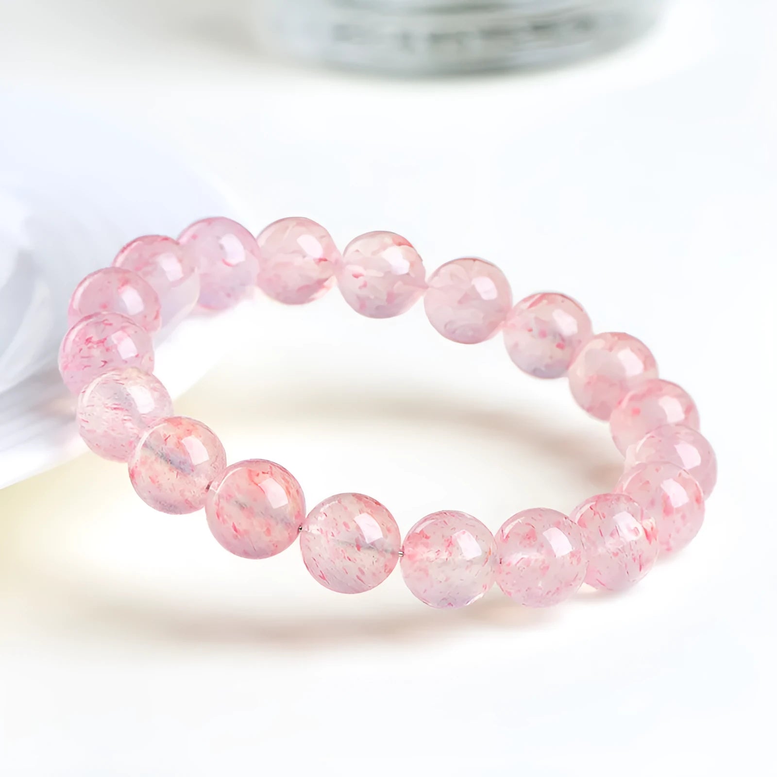 Natural white water strawberry quartz crystal ball bracelet with 10mm geometric beads.