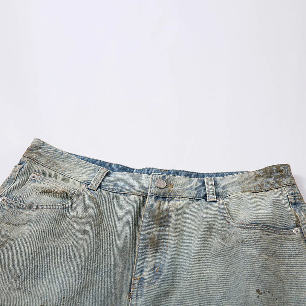 Blue washed denim cropped middle pants with straight leg and zipper fly on a model.