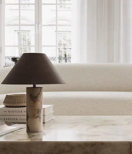 Modern black marble table lamp with minimalist design on wooden surface