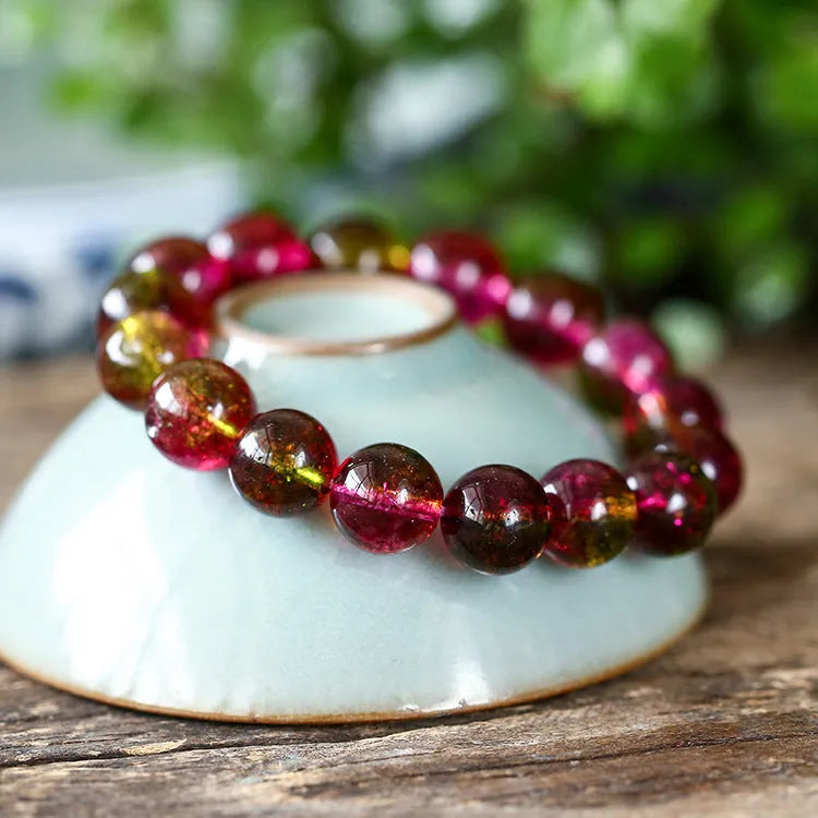 Handmade watermelon crystal women's bracelet showing pastoral design in four diameter sizes
