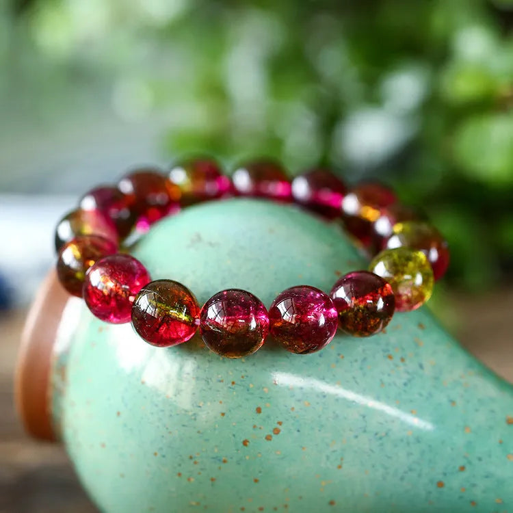 Handmade watermelon crystal women's bracelet showing pastoral design in four diameter sizes