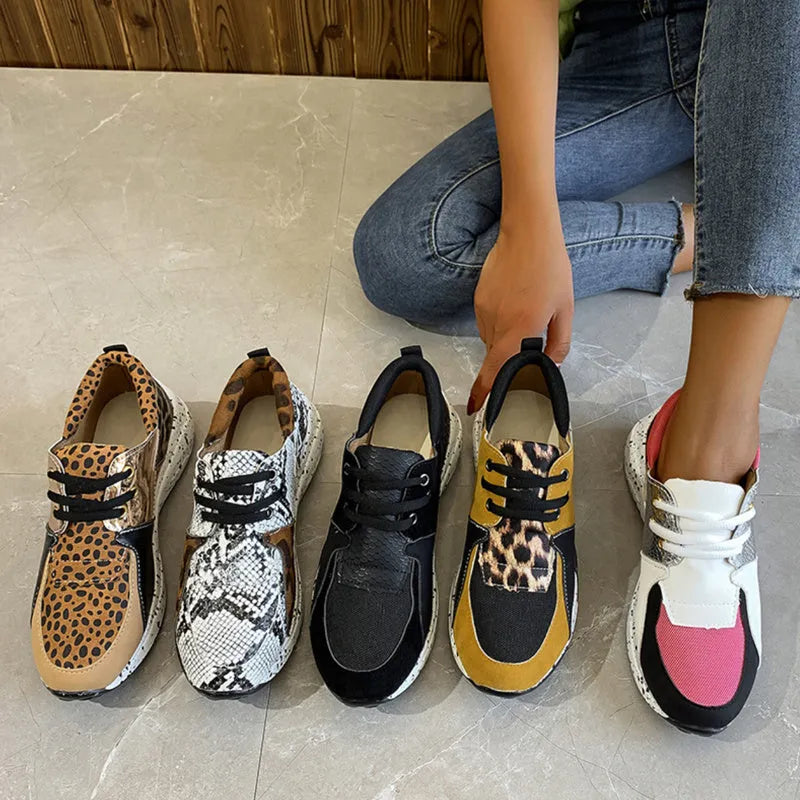 Women's casual suede sneakers with a wedge heel in various colours including black, pink, and leopard print.