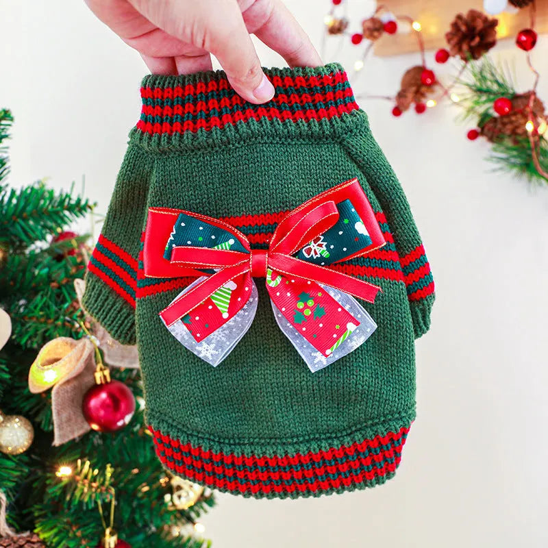 Red and green dog Christmas jumpers on a size chart showing XS, S, M, L, XL for pet weights 1kg to 9kg