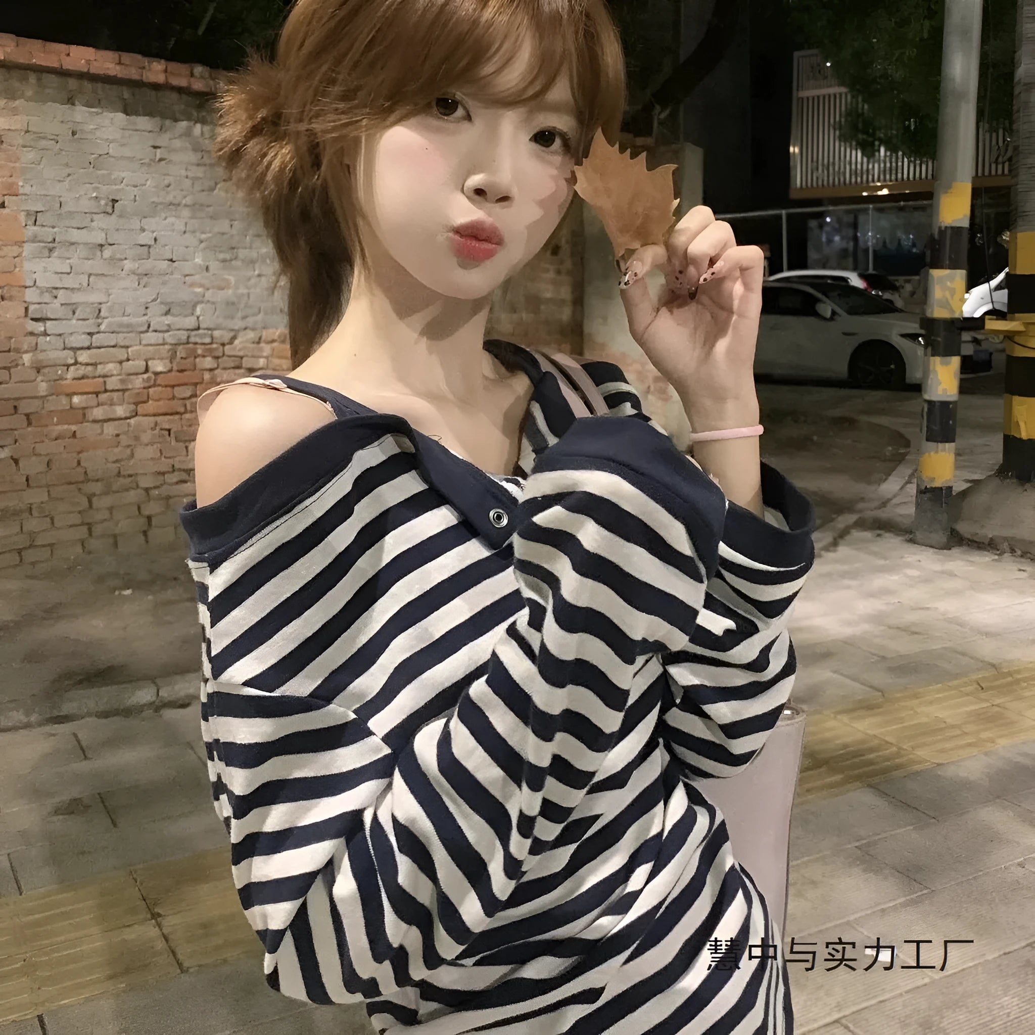 Dark blue oversized Korean-style women's long-sleeved t-shirt with embroidery and stripes.