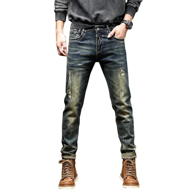 Man wearing skinny fit retro blue jeans with a zip fly, showcasing the casual pencil pants style.