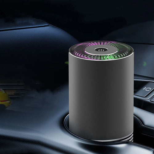 Compact cylindrical car air purifier in metallic grey with aluminium alloy casing.