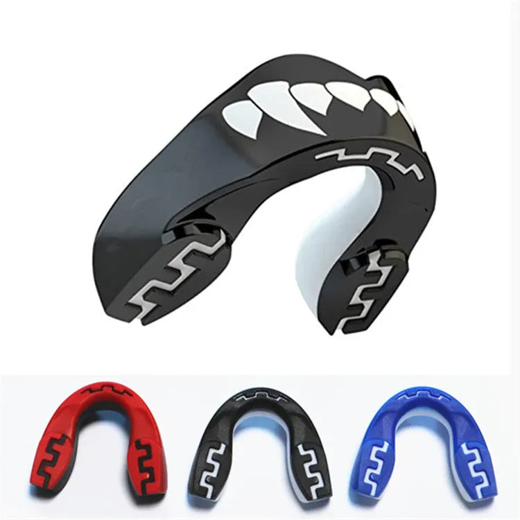 Adult boxing mouthguard with printed teeth design in black and white, for martial arts protection.