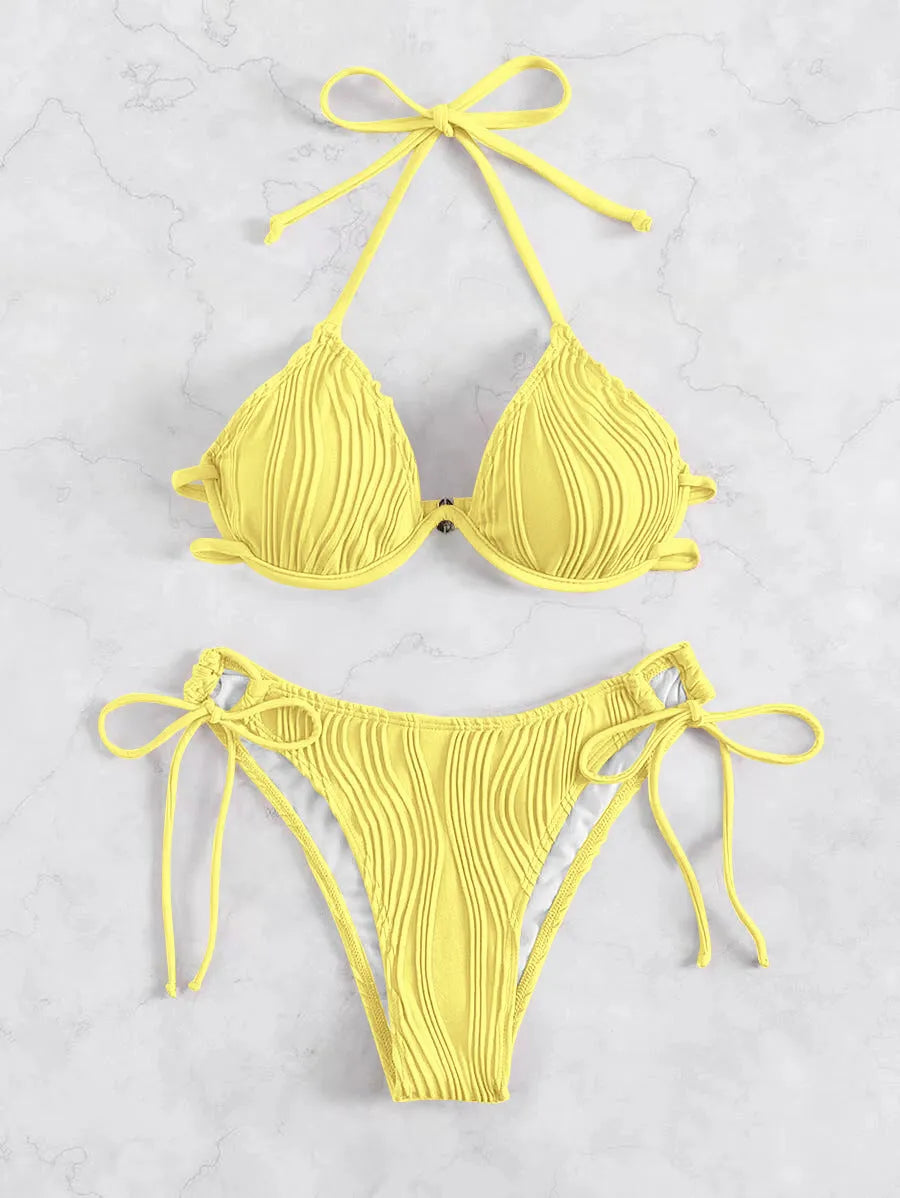 Women's apricot coloured underwire bikini swimsuit with adjustable side-tie bottoms on a mannequin.