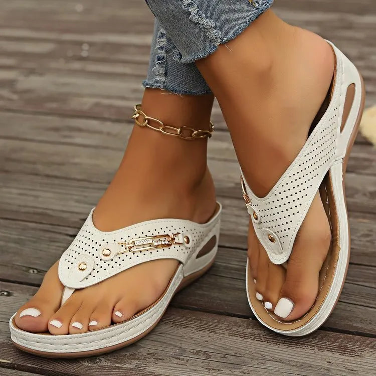 Women's retro flip-flop sandals in beige, showing PU upper and textured sole, on a plain background.