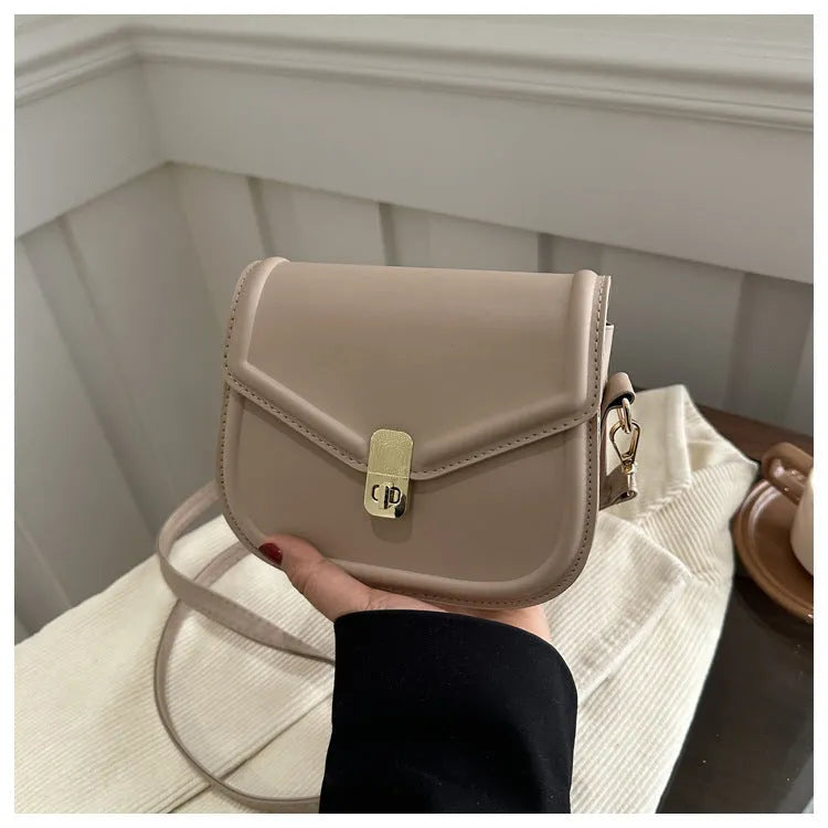 Soft PU shoulder messenger bag in horizontal square clamshell shape with niche texture.