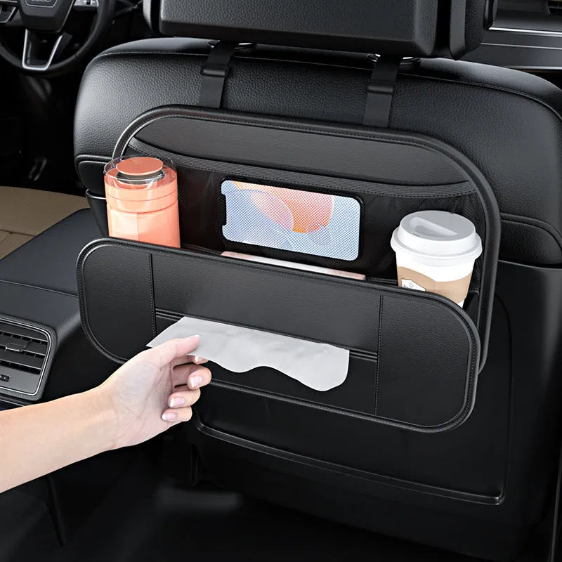 Black leather car seat rear storage bag hanging behind a vehicle seat.