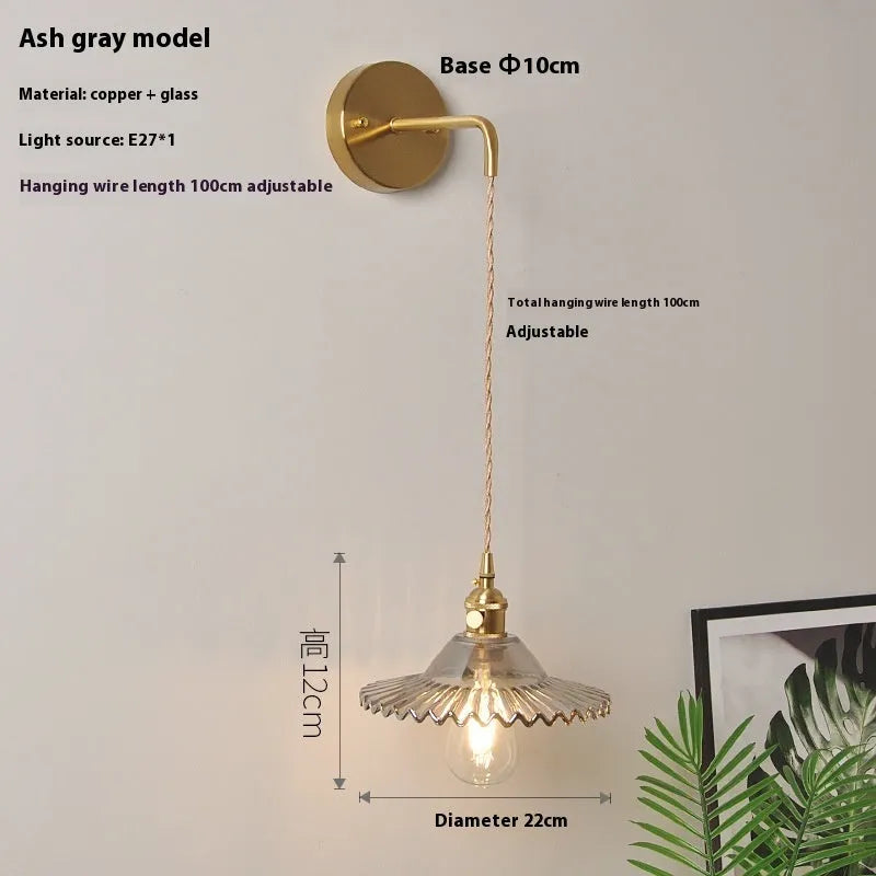 Copper retro lotus wall lamp with glass shade in amber colour variation