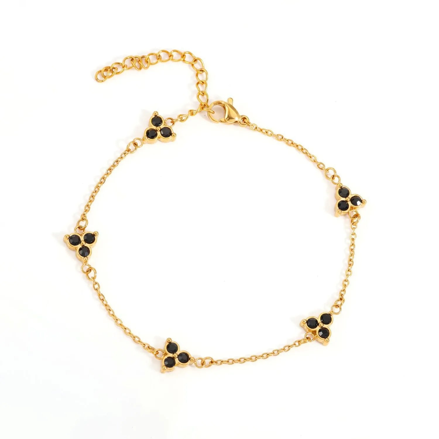 Women's stainless steel geometric triangle bracelet with a three-diamond pattern, shown in a gold and white zircon colour option.