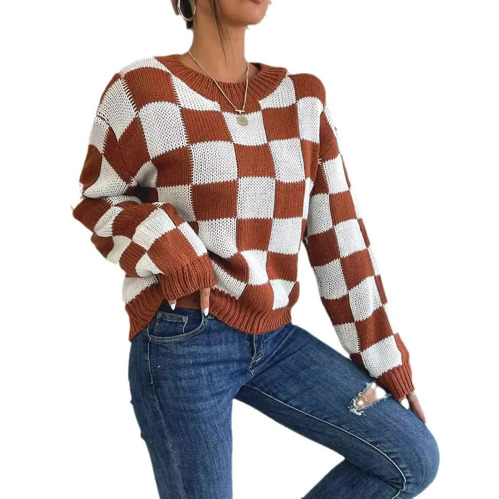 Dark brown plaid loose round neck acrylic pullover sweater on a hanger