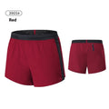 Men's solid colour low-waist basketball shorts made from polyester fabric.