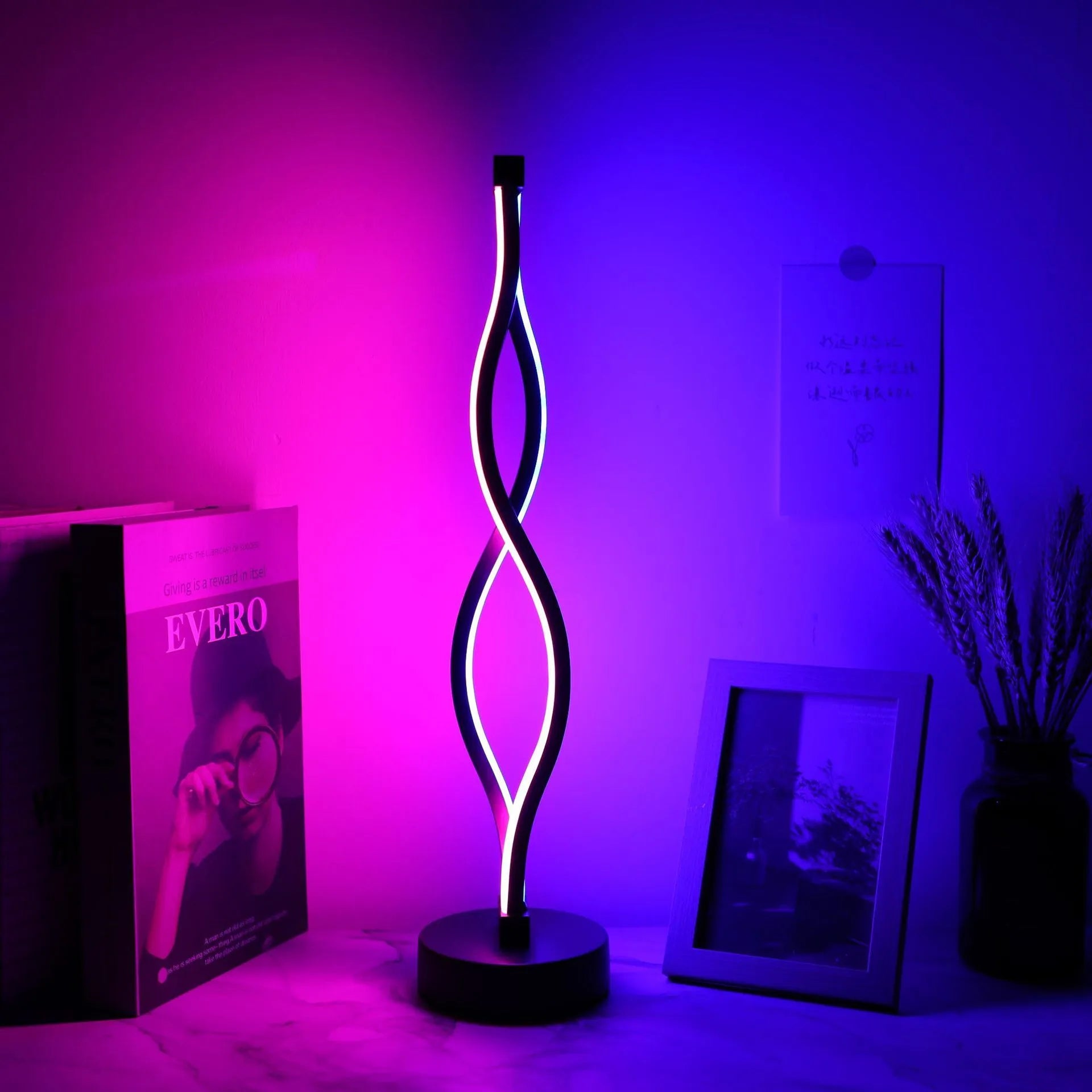 Black aluminium desk lamp with three-colour dimming button and touch controls on desktop