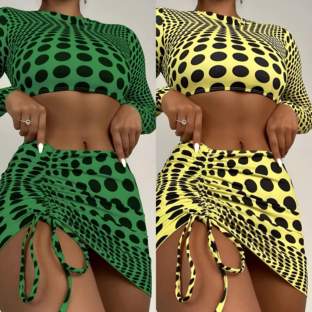 Women's green polka dot three-piece swimsuit set with bra top and skirt on hanger