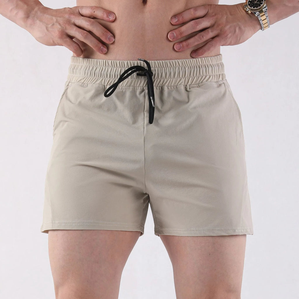 Men's thin grey polyester basketball shorts with an elastic waistband, laid flat.