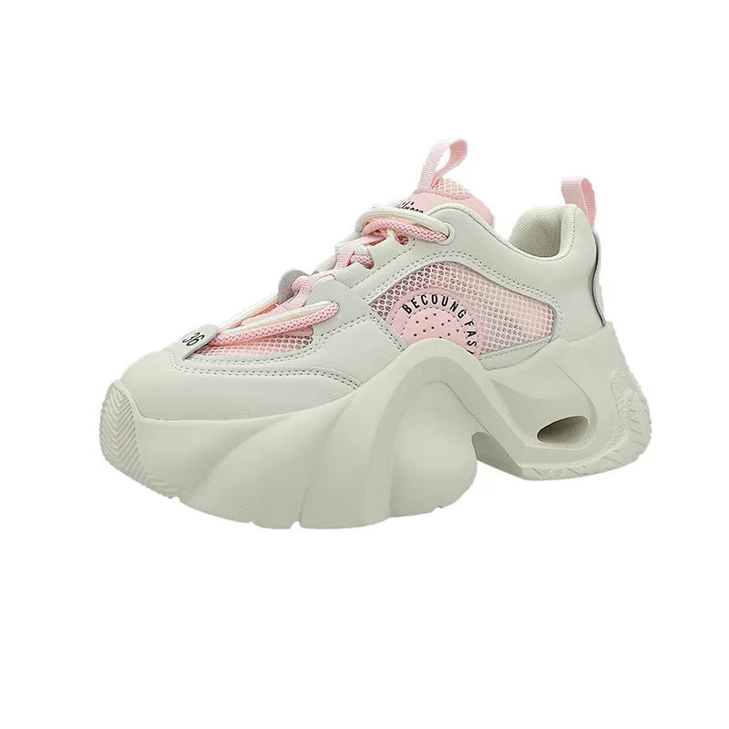 Women's casual sneakers in beige with thick sole, cross shoulder straps, and mesh lining.