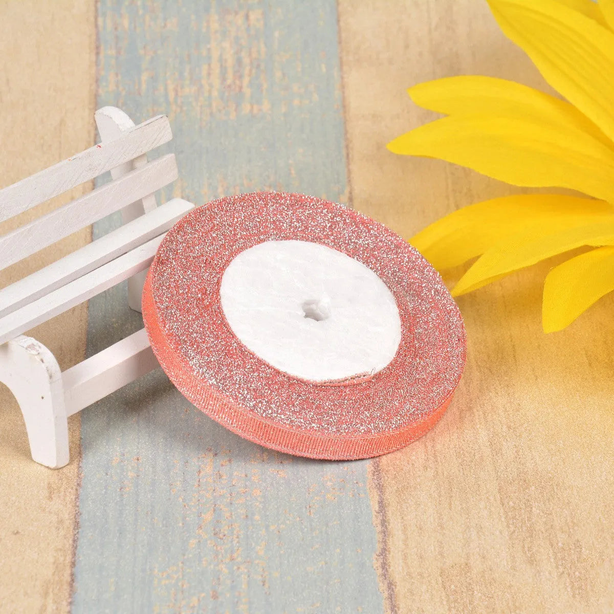 Polyester ribbon spool in metallic colours for decorative clothing and gift packaging trim
