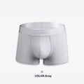Men's solid colour cotton boxers in black, white, silver grey, and light green laid flat