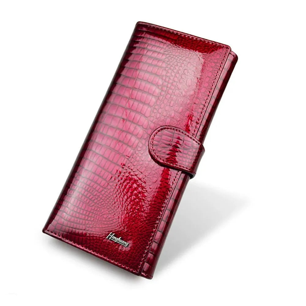 Women's leather coin purse with crocodile pattern texture in red colour showing pigskin lining