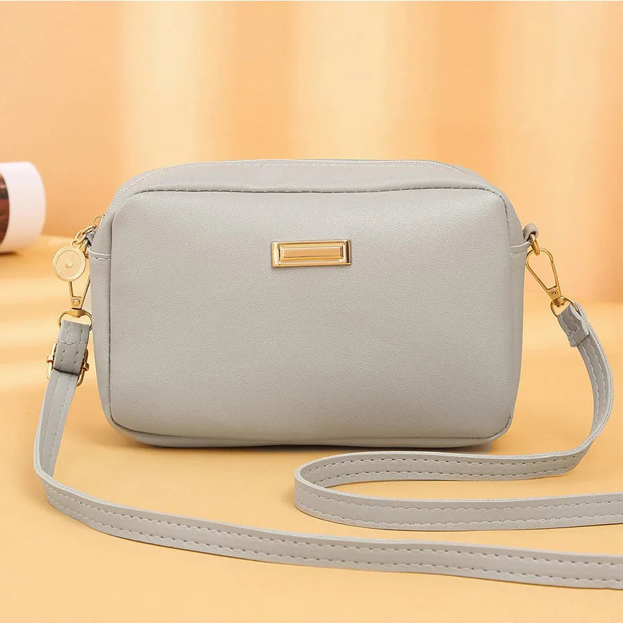 Women's solid colour PU shoulder bag with three-dimensional pockets in horizontal square shape