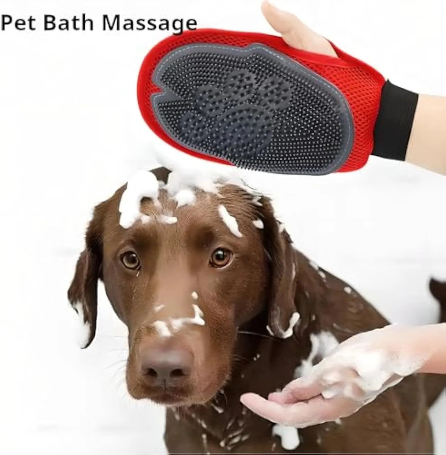 Red pet bathing and grooming glove combining a brush and mitt, shown on a hand.
