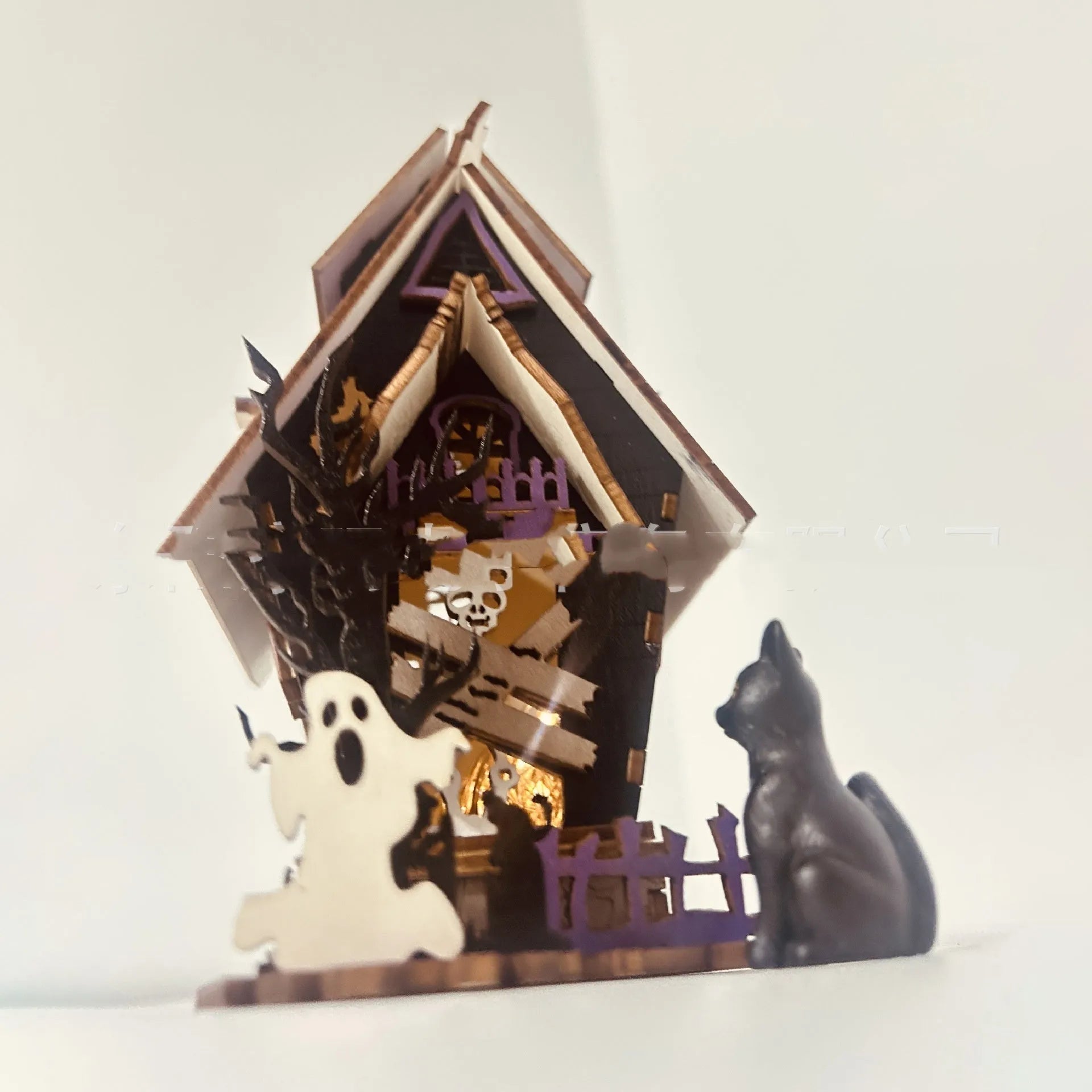 Wooden Halloween haunted house table decoration with luminous finish measuring 14x10.5x19cm