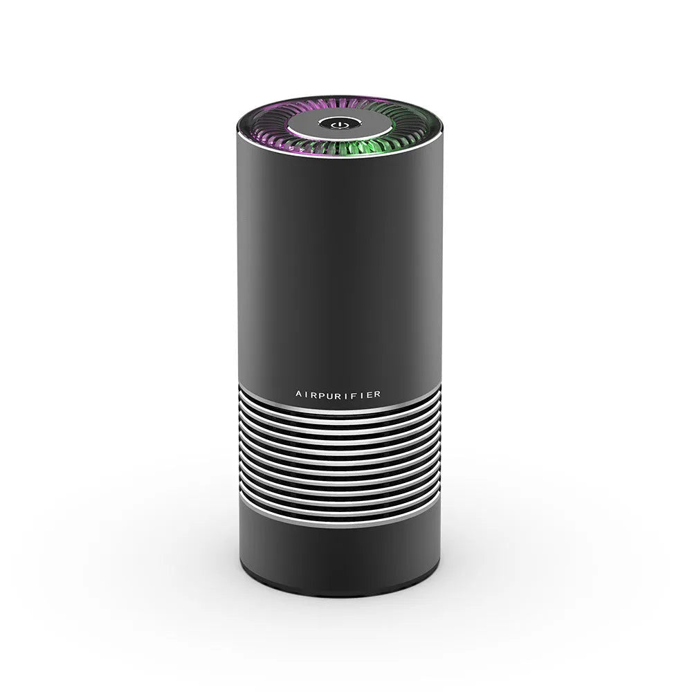 Compact cylindrical car air purifier in metallic grey with aluminium alloy casing.