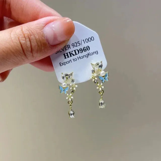 Geometric heart-shaped alloy ear clips with rhinestone and star tassel decorations in gold tone finish
